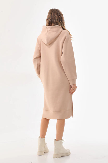 Person wearing a beige hooded coat on a white background